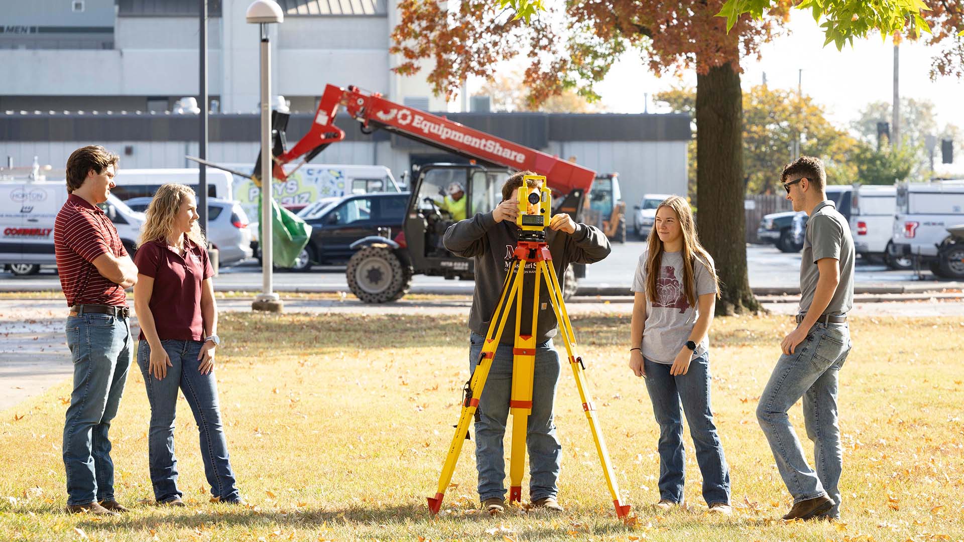 Students Surveying outside of Kemper Hall